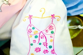 Laundry bag with flower embroidered shirt